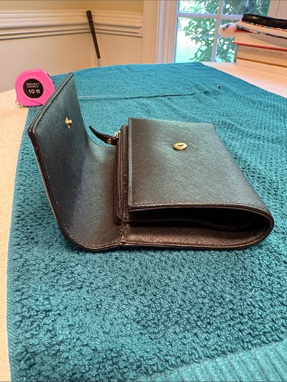 Kate Spade black saffiano tri-fold hand wallet with gold logo